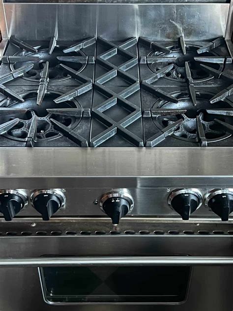 how do i clean the cast iron grates on a gas range